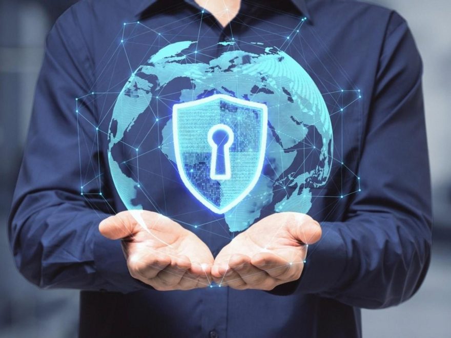 Businessman holding a digital shield representing licensed software security for UAE companies